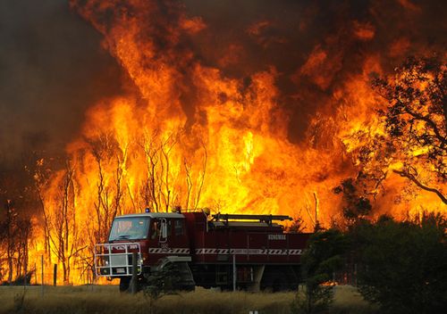 A 2009 file photo showing fire fighters battling bushfires at the Bunyip State Forest near the township of Tonimbuk, Victoria. The Black Saturday bushfires claimed the lives of at least 173 people.