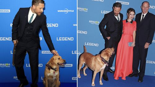 Woody managed to remain well behaved while posing for photos with the cast. (AAP/Getty)