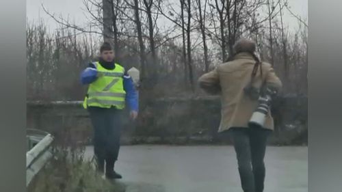 Police at the roadblock. (Sky News)