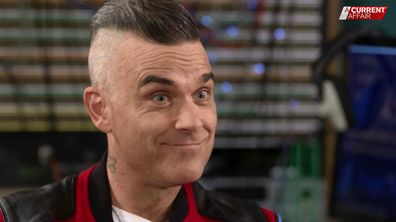 Robbie Williams Christmas Anthem Interview About Family Career Future Aca