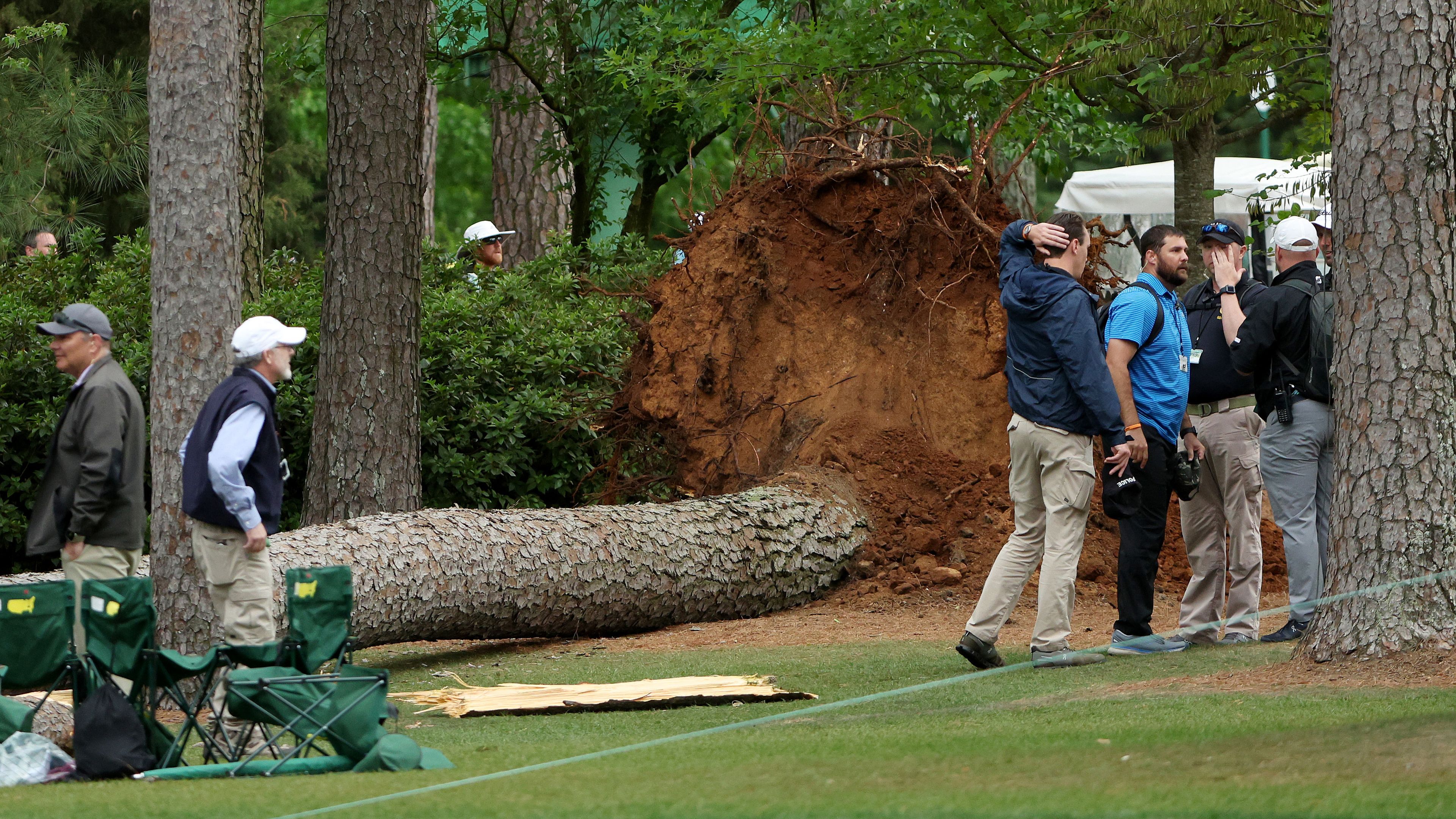 AUGUSTA, GEORGIA - APRIL 07: Course officials look over fallen trees on the 17th tee during the second round of the 2023 Masters Tournament at Augusta National Golf Club on April 07, 2023 in Augusta, Georgia. (Photo by Patrick Smith/Getty Images)