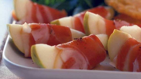 Pears wrapped with prosciutto, served with parmesan wafers