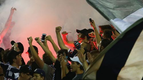 Victory fans cheer during the round seven A-League match between the Melbourne Victory and Brisbane Roar at Etihad Stadium. (Getty)