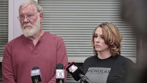 Bill Powell, left, and Amanda Hunt, right, listen to questions during the press conference at the Utah County Sheriff's office on Thursday, March 29, 2018, in Spanish Fork, Utah. The press conference came after Jerrod William Baum was arrested in relation to the deaths of Riley Powell and Brelynne "Breezy" Otteson. (Evan Cobb/The Daily Herald via AP)