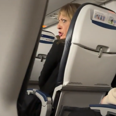 plane passenger shushes crying baby