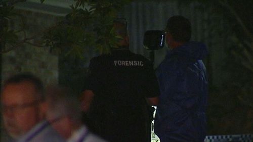 Forensic police are investigating the scene of the deaths in Upper Coomera. (9NEWS)