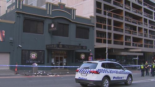 Two suspects wanted over a triple-stabbing inside a strip club in Melbourne's CBD remain on the run as one victim continues to fight for his life.Police said there was an altercation between two groups of men inside The Men's Gallery on Lonsdale Street about 6am on Sunday.