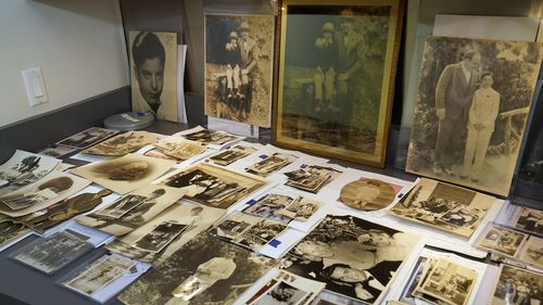 A collection of photographs from the estate of mob boss Al Capone is seen on display at Witherell's Auction House in Sacramento, Calif., Wednesday, Aug. 25, 2021. The photographs are among the 174 family heirlooms that will be up for sale at an Oct. 8 auction titled "A Century of Notoriety: The Estate of Al Capone," that will be held by Witherell's in Sacramento. (AP Photo/Rich Pedroncelli)