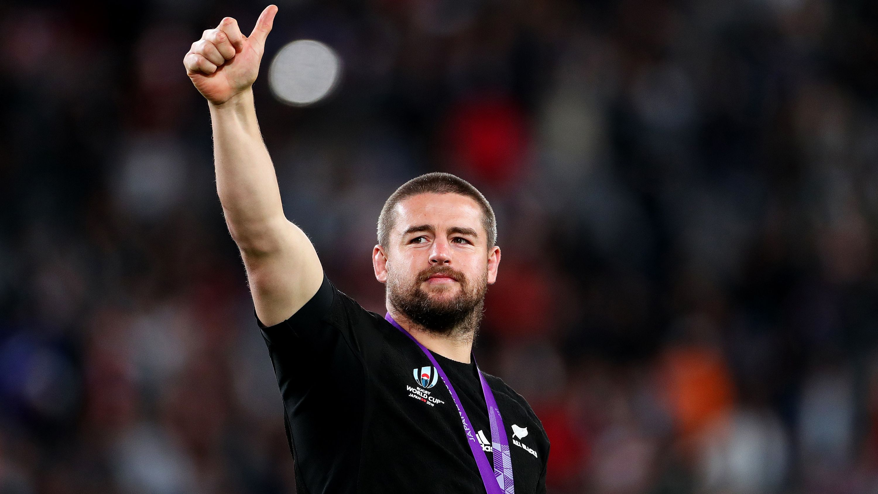 Dane Coles acknowledges fans with his bronze medal after the 2019 Rugby World Cup bronze final match between New Zealand and Wales.