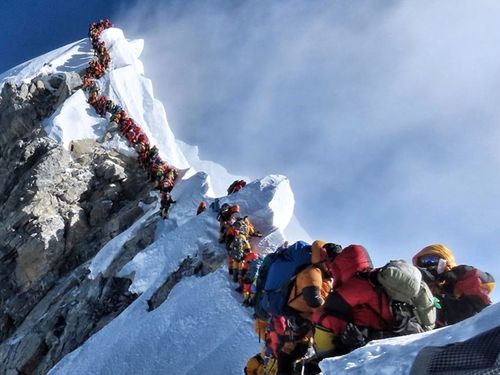 A long queue of mountain climbers line a path on Mount Everest, in this photograph that made headlines around the world.