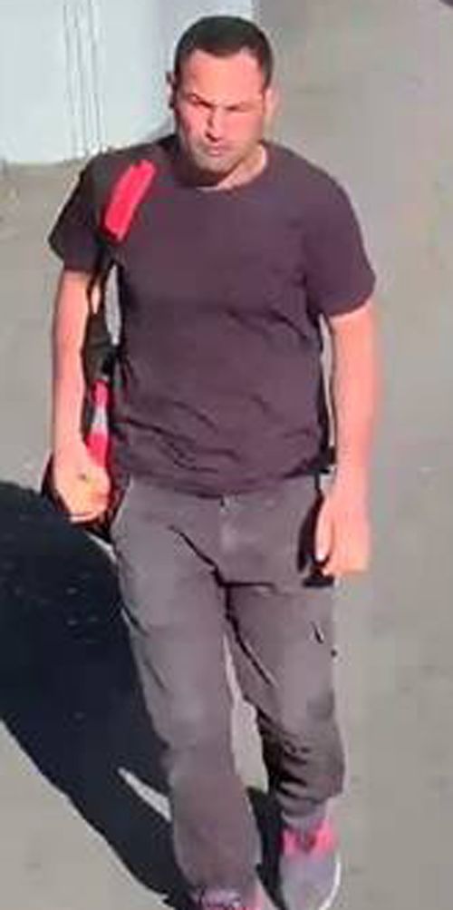 The man is described as 30 to 35 years old, with short dark hair and a muscular build. He was wearing a dark blue T-shirt and dark pants at the time.