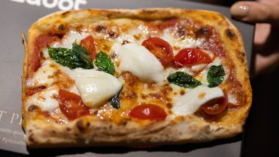 This is what pizza made by a robot looks like, but it's had some human help too