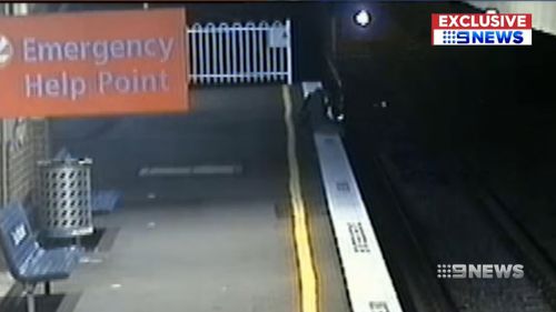 A boy seen dangling his legs over the tracks before a train emerges. Picture: Supplied