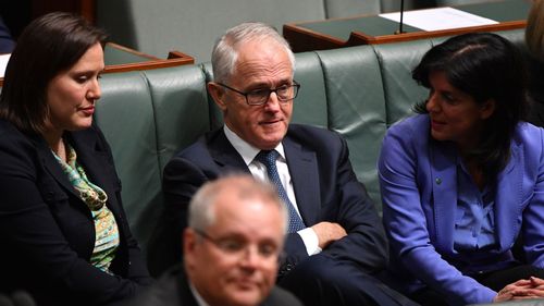 Kelly O'Dwyer, Julia Banks and Malcolm Turnbull deep in conversation amid the Liberal leadership spill. 