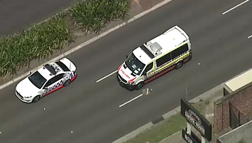 An ambulance is escorted by a police vehicle. (9NEWS)