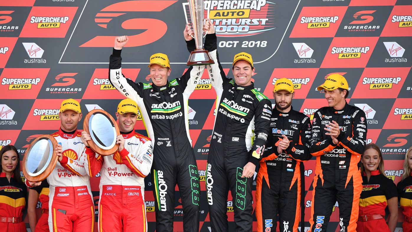 Craig Lowndes (right) and Steven Richards of Autobarn Lowndes Racing celebrate winning the Bathurst 1000 V8 Super Cars Championship in 2018