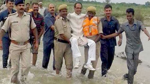 Twitter users mock Indian politician carried through floods