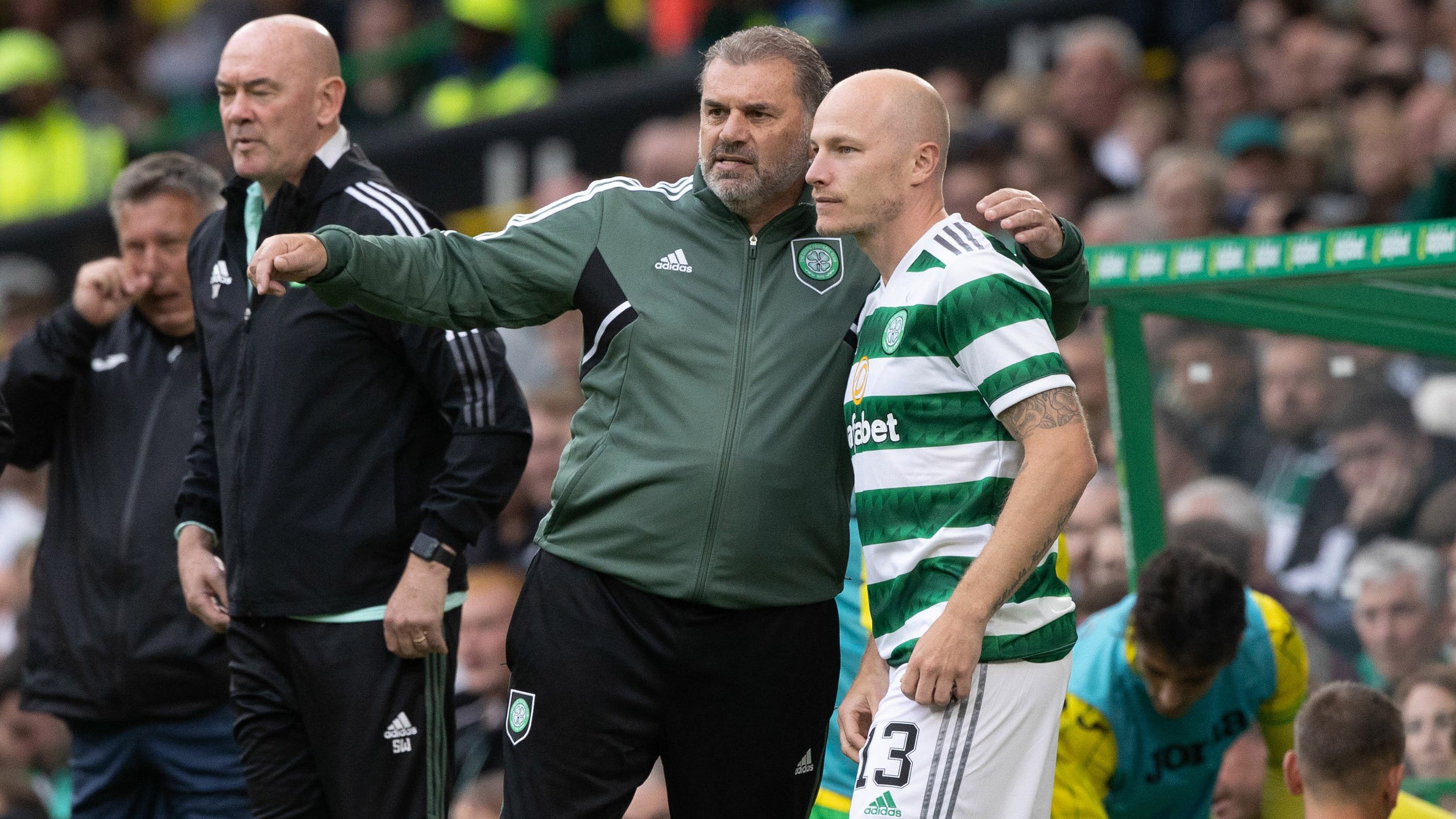 Celtic manager Ange Postecoglou speaks to Aaron Mooy.