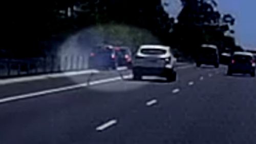 Another driver's dashcam caught the heart-stopping moment a highway officer was rammed into on the NSW Mid North Coast.