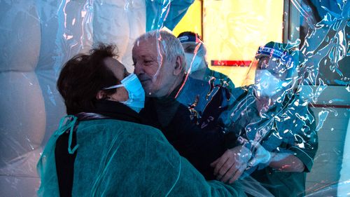 Family members hug each other inside a hug room set up at the Villa Troisi Rest Home in Montefalcione, Italy. The hug room in Campania was an initiative of the A5 Consortium to allow, after long months of isolation due to the restrictive anti-COVID-19 measures, the elderly guests of the social welfare structures to meet their families closely and be able to hug and hold each other hands