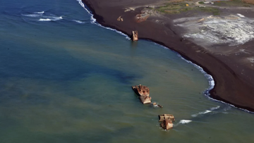The ships washed ashore on the western side of Iwo Jima. 