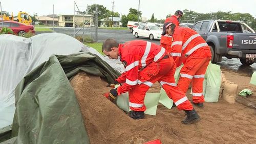 Sandbagging stations have been set up to assist people with preparing their homes for the rain in Queensland. (9NEWS)