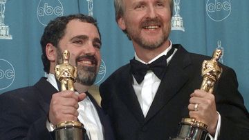 FILE - James Cameron, right, and Jon Landau hold the Oscars for Best Picture for the film &quot;Titanic&quot; at the 70th annual Academy Awards at the Shrine Auditorium in Los Angeles, March 23, 1998. Landau, an Oscar-winning producer who worked closely with director Cameron on Titanic&quot; and the Avatar series, has died, announced in a statement Saturday, July 6, 2024. (AP Photo/Reed Saxon, File)