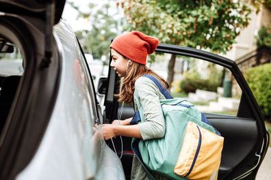 Teen getting on car