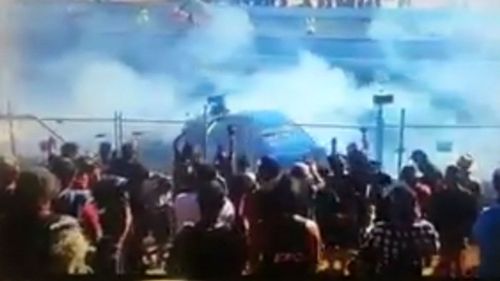 Racing spectators were 'sprayed with fuel'. (9NEWS)