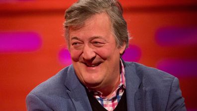 Stephen Fry falls six feet off stage, taken to hospital for