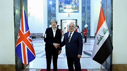 Iraqi Prime Minister Haider al-Abadi shakes hands with British Prime Minister Theresa May in Baghdad, Iraq (Iraqi Prime Minister Press Office via AP)