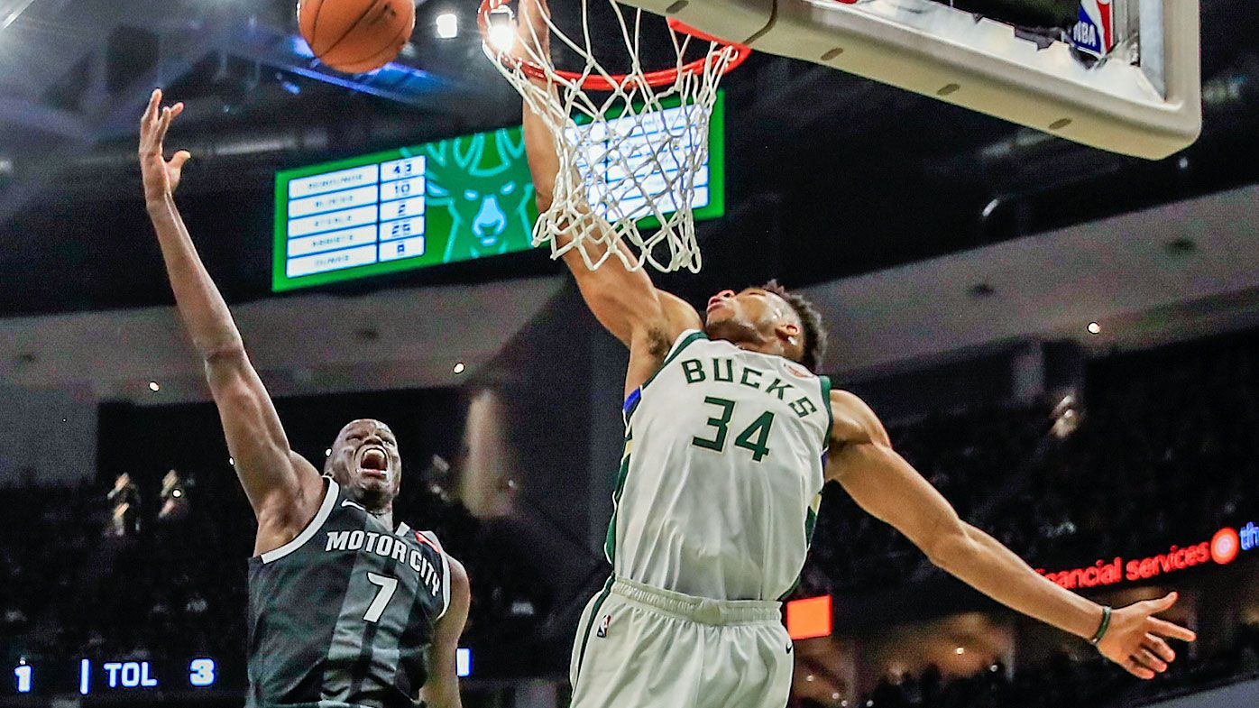 Bucks forward Giannis Antetokounmpo blocks a shot by Detroit Pistons forward Thon Maker