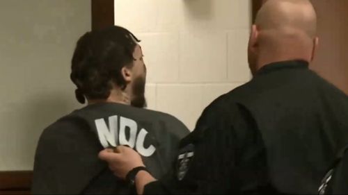 Accused killer Brice Rhodes was removed from the court after Elizabeth Marie Wren threw herself at him. (WLKY)