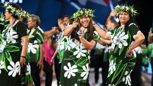 Athletes from Fiji smile as they arrive during the Opening Ceremony. (Getty Images)