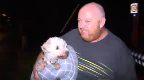 The dog was rescued from inside one of the burning units. (9NEWS)