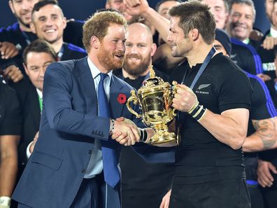 Prince Harry presents Richie McCaw with the Webb Ellis Cup after New Zealand beat Australia in the 2015 Rugby World Cup Final 