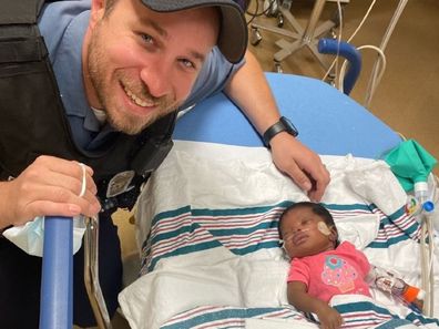 police officer bond with baby he revived kansas city US