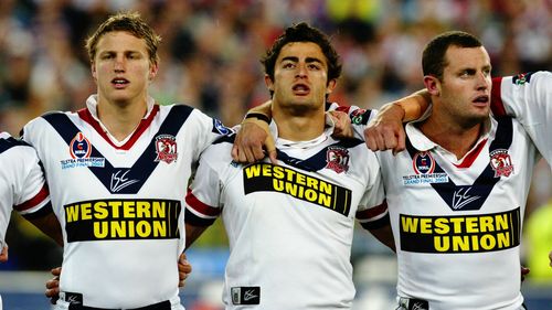 Chris Walker, right, has been arrested on alleged domestic violence offences on the Gold Coast.