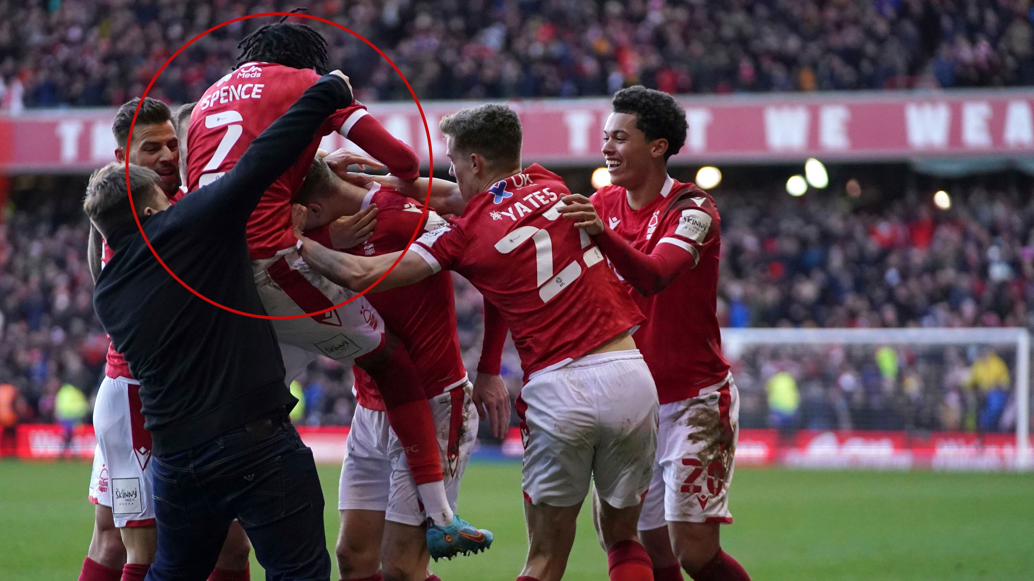 A man invades the pitch as Nottingham Forest celebrate scoring their side&#x27;s third goal of the game.