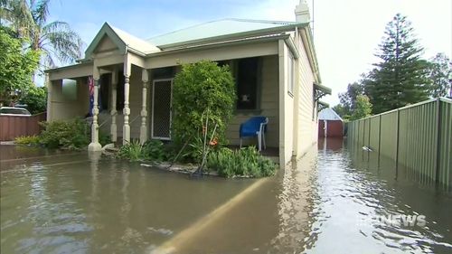 The front yards of homes were flooded.