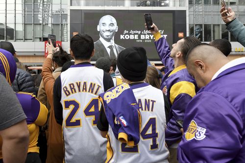 People gather at a memorial near Staples Center after the death of Laker legend Kobe Bryant