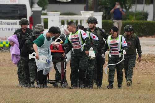 A wounded Thai soldier is carried to be transferred to a hospital, in Surin province, Thailand, Wednesday, Dec. 10, 2025, following clashes between Thai and Cambodian soldiers. (AP Photo/Sakchai Lalit)