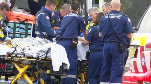 NSW Ambulance paramedics treat the injured man in Wyong.