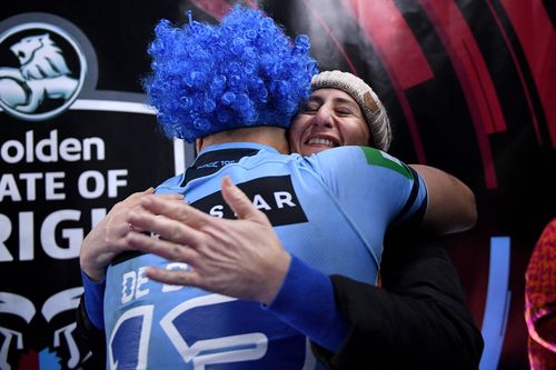 NSW premier Gladys Berejiklian gives Jack de Bellin a hug after the win. Picture: AAP