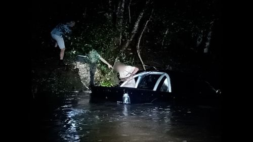 A man rescued from flood waters in Conondale.