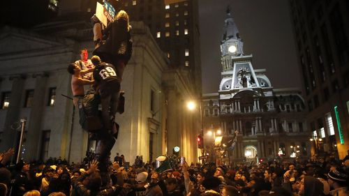 Philadelphia Eagles fans celebrate the team's victory in NFL Super Bowl 52 between the Philadelphia Eagles and the New England Patriots. (AAP)