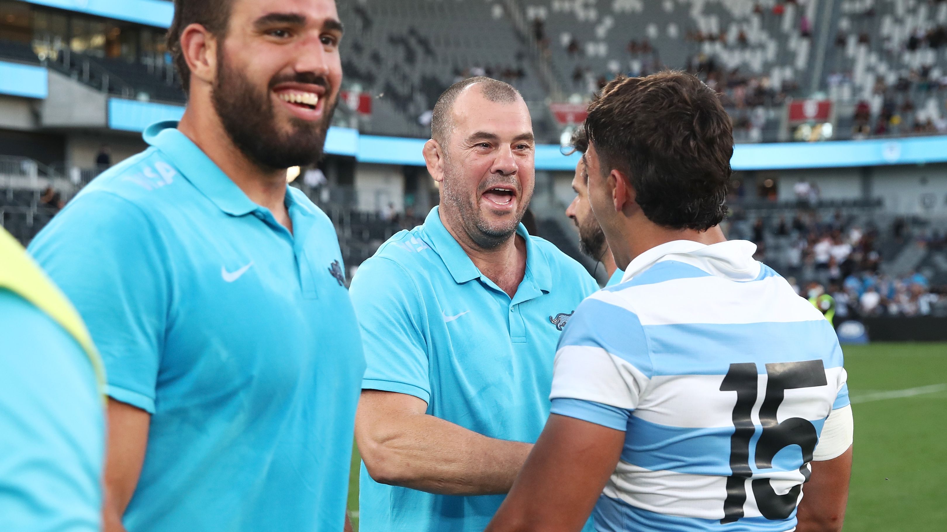 Michael Cheika celebrates with Santiago Carreras of the Pumas after beating the All Blacks.
