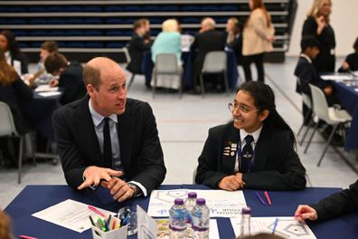 BIRMINGHAM, ENGLAND - APRIL 25: Britain's Prince William, Prince of Wales speaks with students using the "Talking Tables" initiative, during a visit to St. Michael's Church of England High School in Rowley Regis, on April 25, 2024. During his visit Prince William, Prince of Wales will learn about the award-winning student-led initiatives available to pupils to support their mental health and wellbeing. (Photo by Oli Scarff - WPA Pool/Getty Images)