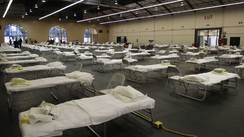 Cots are set up at a possible COVID-19 treatment site in San Mateo, California.