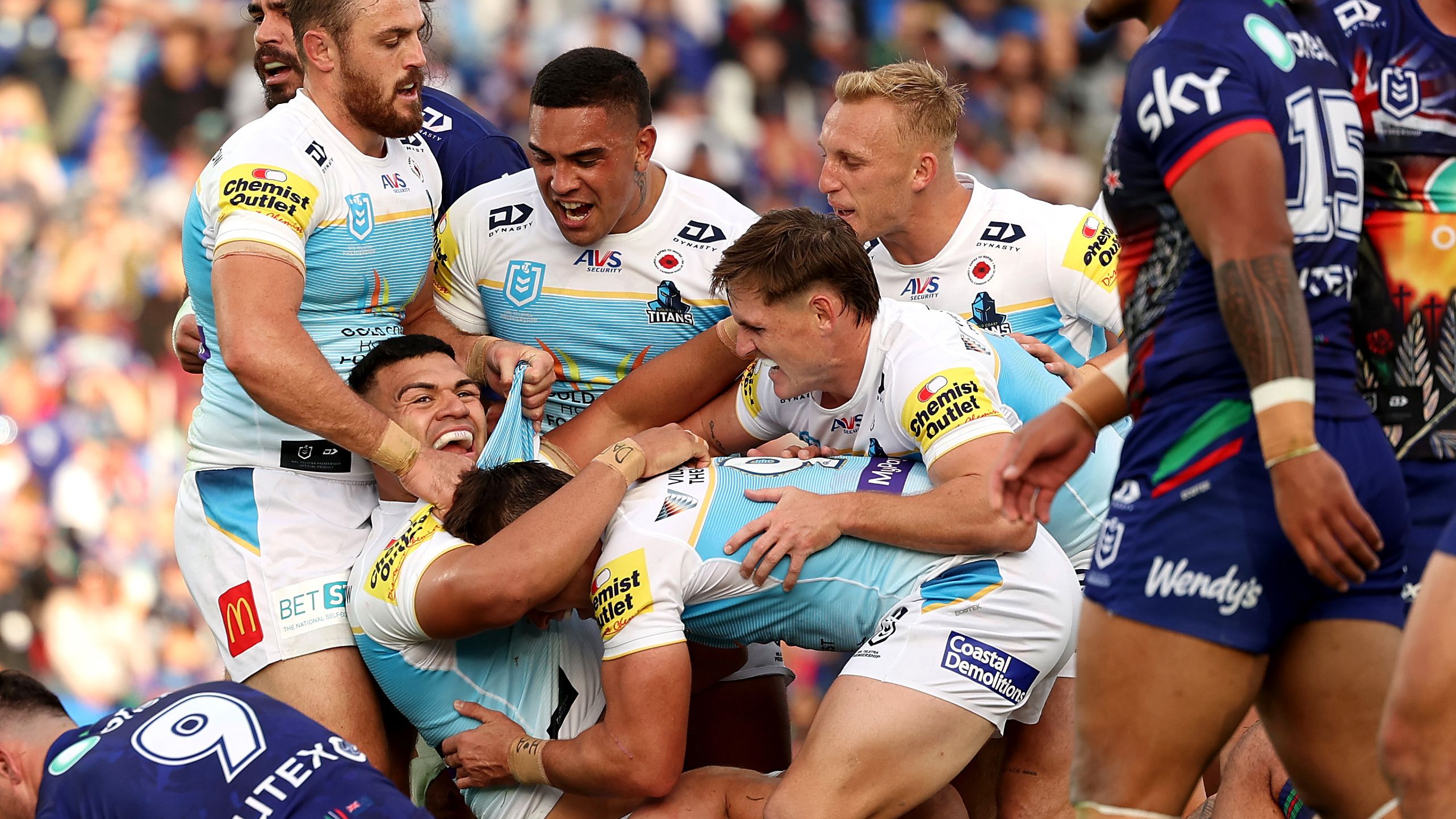David Fifita celebrates his try with teammates during the round eight NRL match between the Warriors and the Gold Coast Titans.